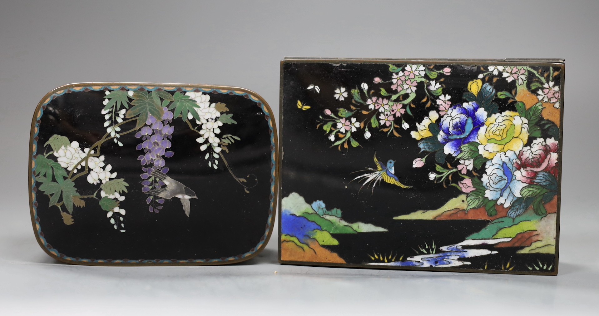 A Japanese silver wire cloisonné enamel box and cover, Meiji period and an early 20th century Japanese cloisonné enamel cigarette box, 13.5cms wide x 10cms deep